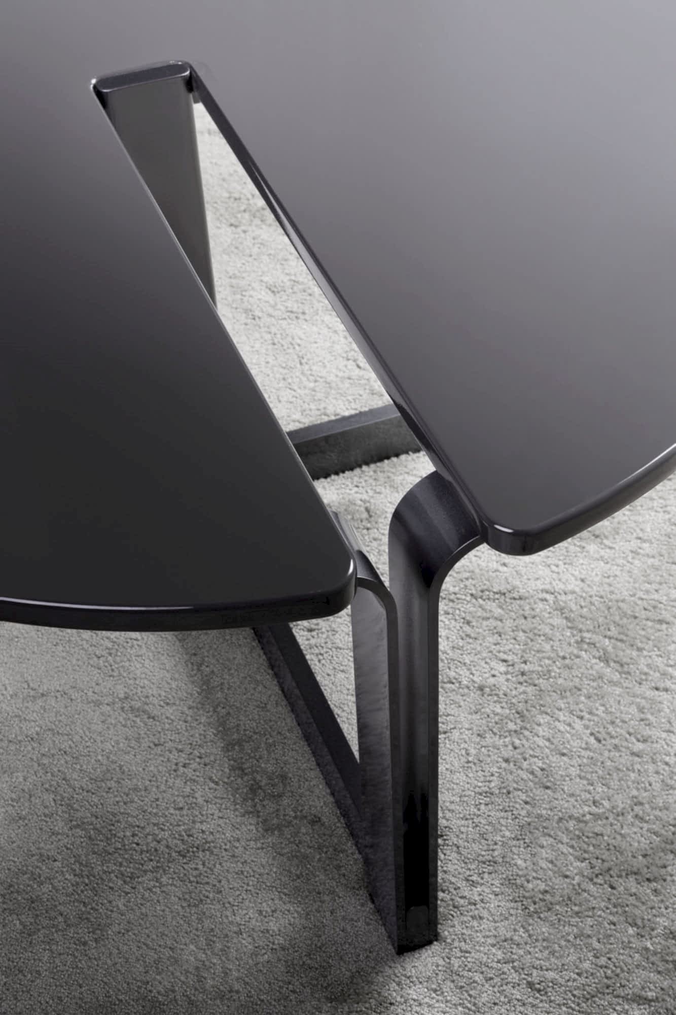 The Cut-Out Coffee Table is a stunning and innovative piece that combines modern design with functional elements.