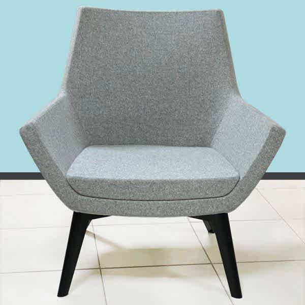 armchair, boasting a sophisticated geometric pattern that amplifies contemporary style.