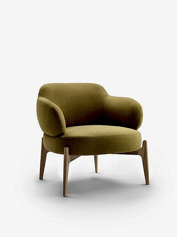 Discover the essence of luxury in our designer armchair, its legs a visual and functional delight.