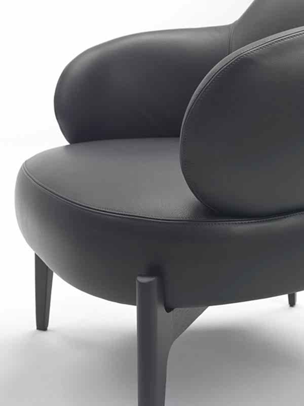 meticulously designed armchair, showcasing refined legs.