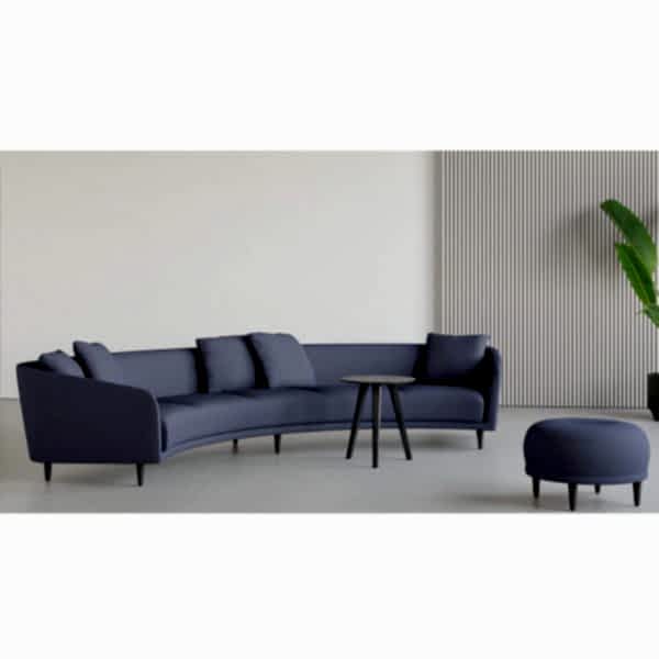 blue curved sofa and pouf