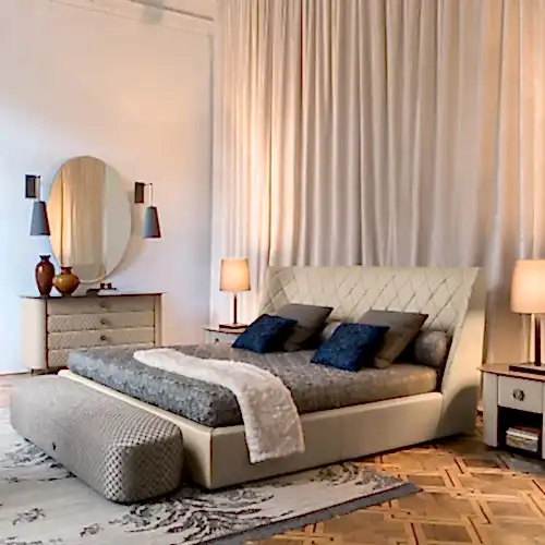 Bed with night side tables and a chest of drawers