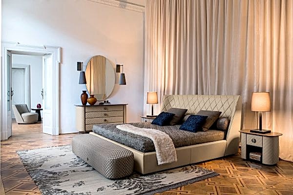 a true masterpiece of design, this large bed features a beautiful diamond-shaped headboard and a sleek, modern base that will elevate any bedroom